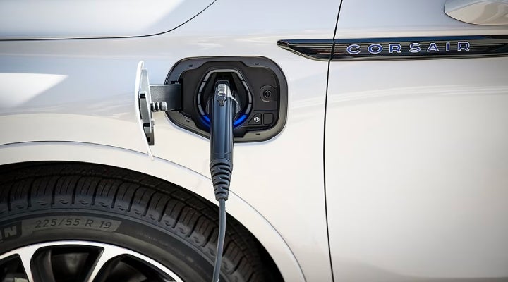 An electric charger is shown plugged into the charging port of a Lincoln Corsair® Grand Touring
model. | Asheville Lincoln in Asheville NC