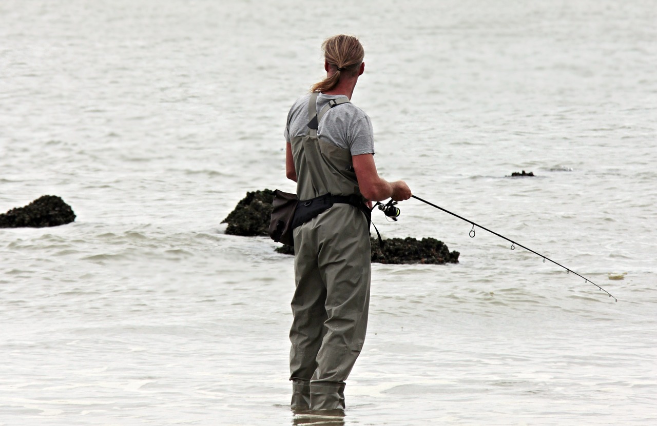 A man fishing by a body of water