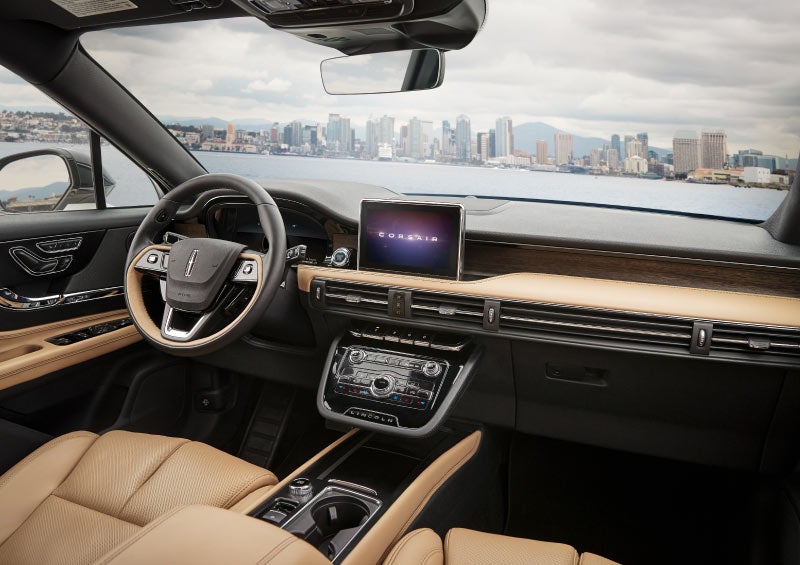 A cashew and ebony interior boasts horizontal design lines and spacious seating room against a city skyline