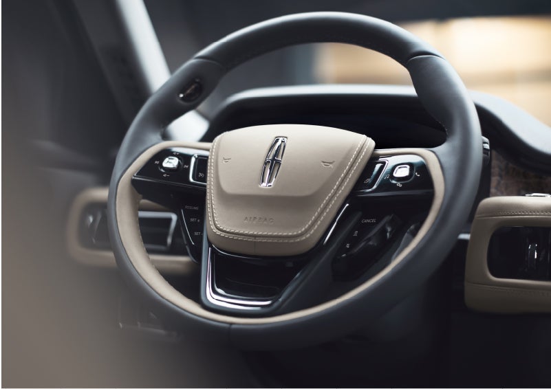 The intuitively placed controls of the steering wheel on a 2023 Lincoln Aviator® SUV | Asheville Lincoln in Asheville NC