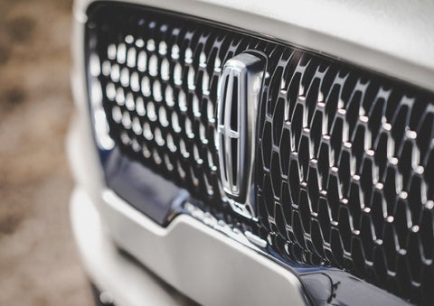 The grille of the 2024 Lincoln Aviator® Reserve model with an eye-catching repeated field of Lincoln Star logo shapes | Asheville Lincoln in Asheville NC