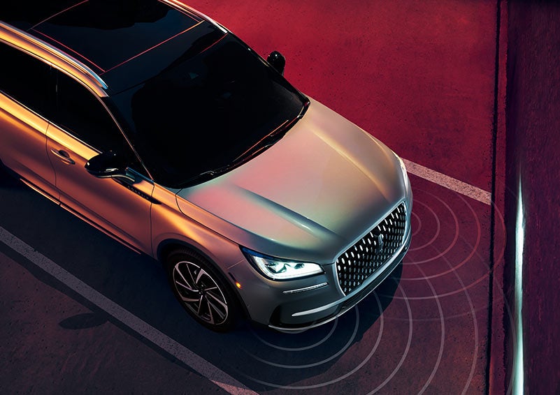 Illustrated radar signals are shown emitting from the front of a 2024 Lincoln Corsair® SUV.