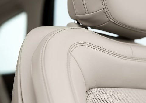 Fine craftsmanship is shown through a detailed image of front-seat stitching.
