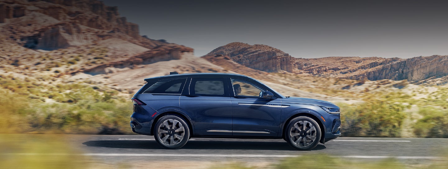 A 2024 Lincoln Nautilus® SUV is being driven in a desert setting. | Asheville Lincoln in Asheville NC