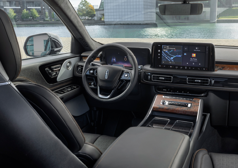 The interior of the 2025 Lincoln Aviator® SUV is shown parked with a view of a harbor through the windshield. | Asheville Lincoln in Asheville NC