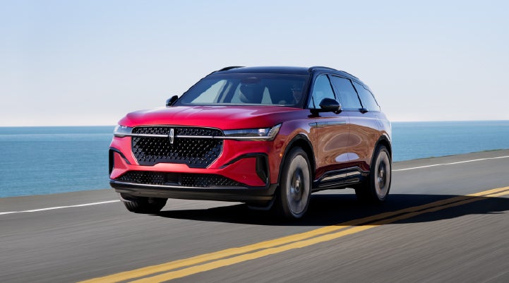 A 2025 Lincoln Nautilus® SUV is being driven on a seaside roadway. | Asheville Lincoln in Asheville NC