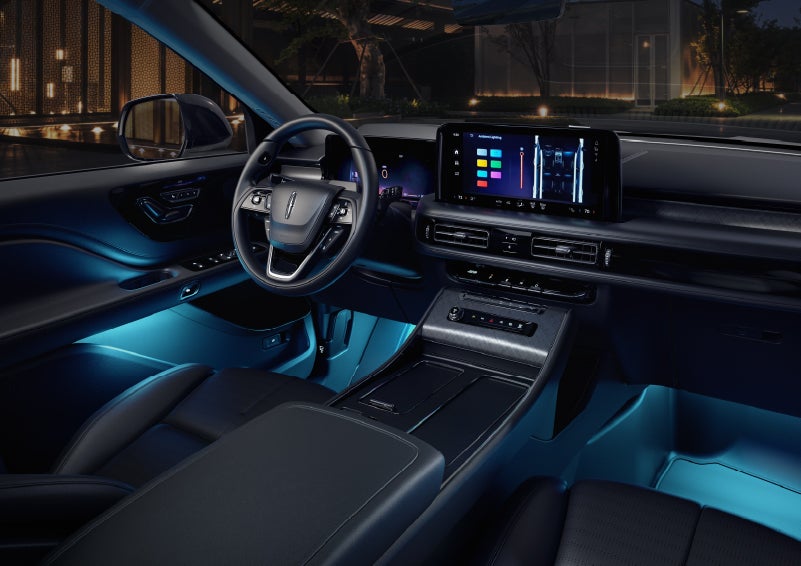 Deep blue ambient lighting glows from various places within a 2026 Lincoln Aviator® SUV. | Asheville Lincoln in Asheville NC