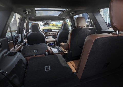 One side of the PowerFold® third-row seat and a second-row seat are folded forward in the 2026 Lincoln Aviator® SUV. | Asheville Lincoln in Asheville NC