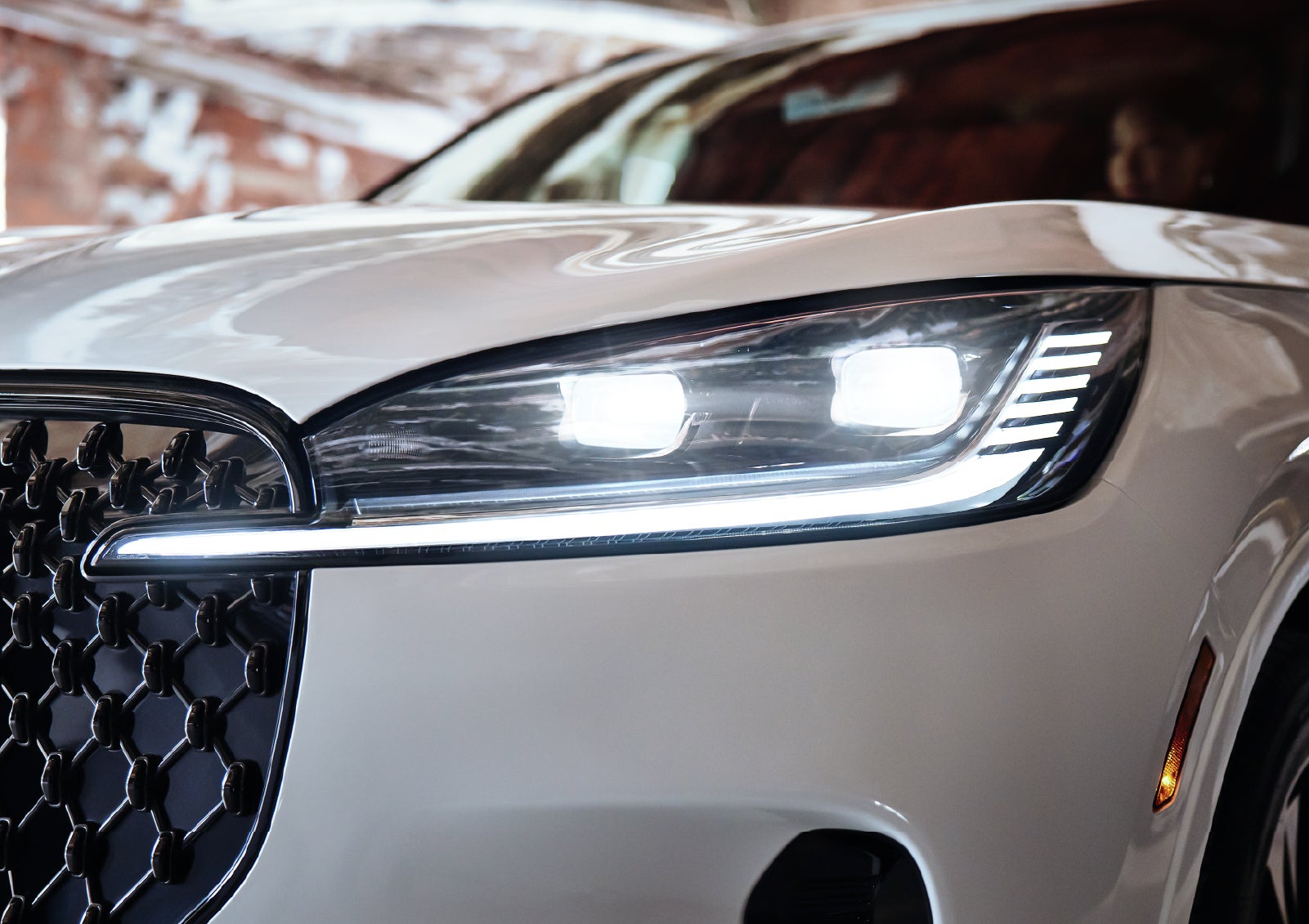 A close-up of a headlamp on the 2027 Lincoln Aviator® SUV is shown. | Asheville Lincoln in Asheville NC