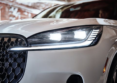 A close-up of a headlamp on the 2027 Lincoln Aviator® SUV is shown. | Asheville Lincoln in Asheville NC