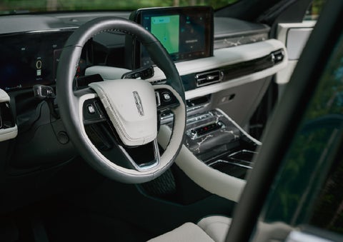 The leather-trimmed steering wheel of a 2027 Lincoln Aviator® Black Label™ SUV. | Asheville Lincoln in Asheville NC
